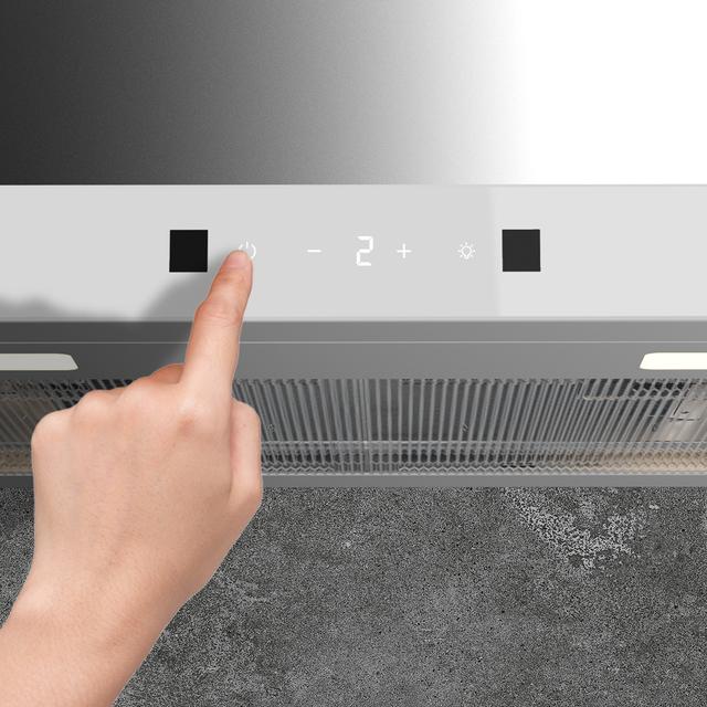 Bolero Flux TT 604400 Inox A++ Hotte aspirante en T, 60 cm, avec une puissance d'aspiration de 413,3 m³/h, classe A++, contrôle tactile invisible, finition en acier inoxydable et façade en verre blanc, moteur BLDC, Hand Movement Control, fonction Booster, filtres lavables, option filtres à charbon inclus pour la recirculation.