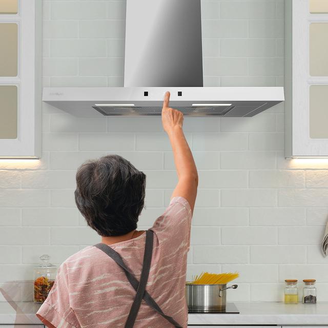 Bolero Flux TT 704400 Black A++ Hotte aspirante en T, 70 cm, avec une puissance d'aspiration de 413,3 m³/h, classe A++, contrôle tactile invisible, finition noire et façade en verre noir, moteur BLDC, Hand Movement Control, fonction Booster, filtres lavables, option filtres à charbon inclus pour la recirculation.