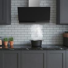 Bolero Flux DT 604400 Matt Black A+++ Hotte aspirante décorative de 60 cm en verre mat et brillant, cheminée en inox, avec une puissance d'aspiration de 416,5 m³/h, classe A+++, moteur BLDC, contrôle tactile invisible, Hand Movement Control, 3 vitesses, fonction Booster, éclairage LED, filtres en aluminium, option filtres à charbon inclus.