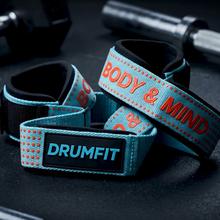 Drumfit lifting straps: correas de entrenamiento en algodón reforzado con agarre de silicona y cierre de muñeca ajustable. Ofrecen soporte seguro y cómodo para levantamiento de pesas, remo con barra, dominadas y ejercicios de fuerza intensos.