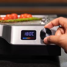 Teppanyaki Steel Plancha eléctrica tipo teppanyaki con placa de acero inoxidable desmontable, temperatura regulable de 100 a 250 °C y accesorios incluidos.