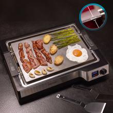 Teppanyaki Steel Plancha eléctrica tipo teppanyaki con placa de acero inoxidable desmontable, temperatura regulable de 100 a 250 °C y accesorios incluidos.