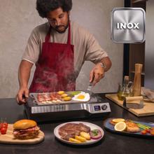 Teppanyaki Steel Plancha eléctrica tipo teppanyaki con placa de acero inoxidable desmontable, temperatura regulable de 100 a 250 °C y accesorios incluidos.