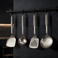 Set di 4 utensili da cucina in acciaio inox Autore