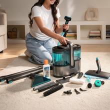 Conga Carpet&Spot Clean 15000 Steam Elite. Limpiatapicerías 3 en 1 con función vapor que pulveriza, aspira y limpia en una pasada. Incorpora motor de 600 W, caldera de 1200 W y vapor a ≥60 ºC para una limpieza más profunda. Cuenta con succión de hasta 12 kPa, depósitos de 1600 ml (agua limpia) y 1500 ml (agua sucia). Incluye 16 accesorios para tapicerías, manchas y limpieza con vapor en múltiples superficies.