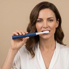 ToothCare Sonic Moon. Escova de dentes elétrica sônica recarregável com 3 modos de escovação, temporizador de 2 minutos e alertas de quadrante a cada 30 segundos. Inclui 2 cabeças de escova e indicador LED.