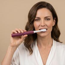 Escova de dentes elétrica sônica ToothCare Sonic Berry. Recarregável, com 3 modos de escovação, temporizador de 2 minutos e alertas de zona a cada 30 segundos. Inclui 2 cabeças de escova e indicador LED.