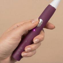 Escova de dentes elétrica sônica ToothCare Sonic Berry. Recarregável, com 3 modos de escovação, temporizador de 2 minutos e alertas de zona a cada 30 segundos. Inclui 2 cabeças de escova e indicador LED.