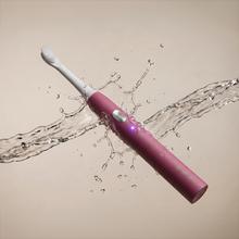 Escova de dentes elétrica sônica ToothCare Sonic Berry. Recarregável, com 3 modos de escovação, temporizador de 2 minutos e alertas de zona a cada 30 segundos. Inclui 2 cabeças de escova e indicador LED.