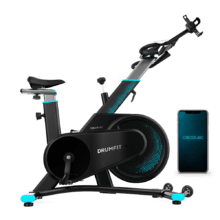 DrumFit Indoor 7000 Magno Connected Cyclette da interno con resistenza magnetica per un allenamento silenzioso, connettività Bluetooth, design sportivo compatto, sella e manubrio ergonomici e regolabili, schermo LCD, supporto per tablet, fermapiedi e ruote per il trasporto.