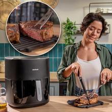 Cecofry&Grill 6500 Friteuse à air avec double élément chauffant pour un brunissement parfait et une saveur grillée sur les viandes, capacité de 6,5 litres et puissance de 2200 W pour des plats sains.